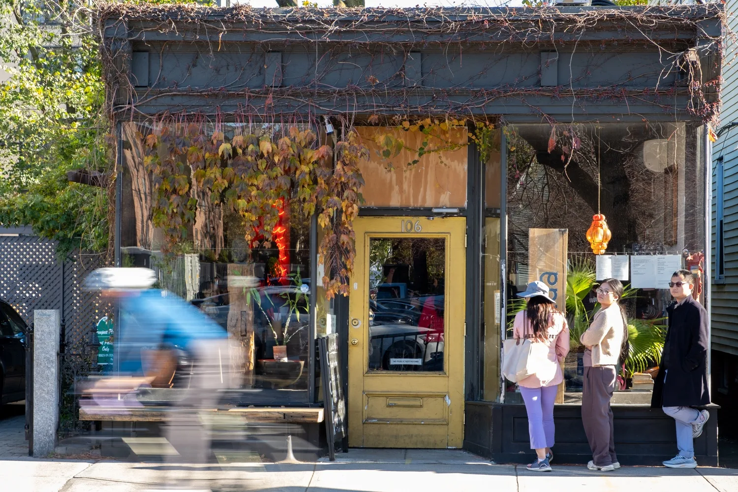 The sunlit exterior of Cicada Coffee Bar in Cambridge
